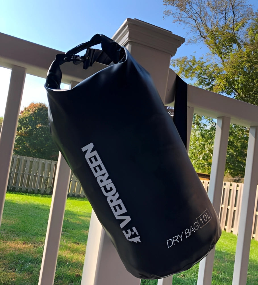 10L waterproof dry bag on grass with trees in the background under a clear sky.