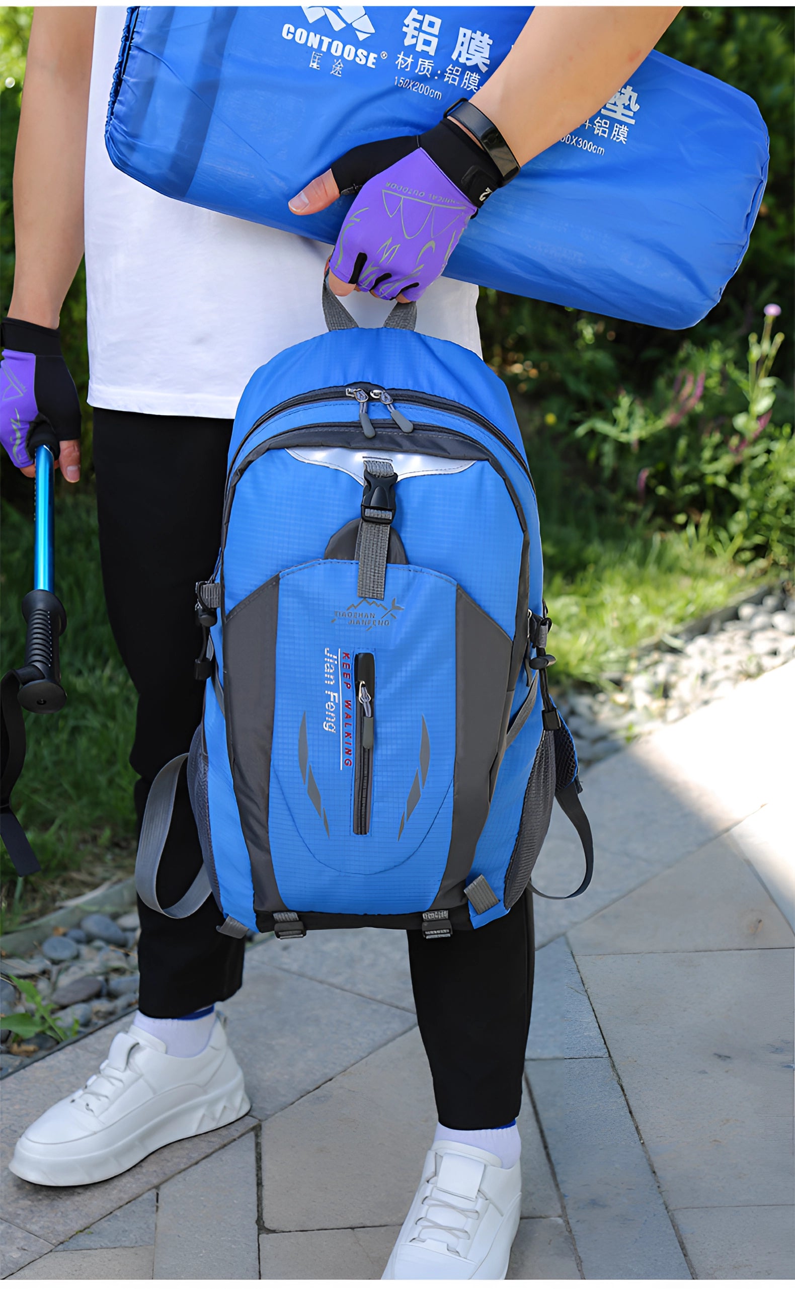 A red 40L waterproof hiking backpack featuring multiple compartments, shown in a studio setting.