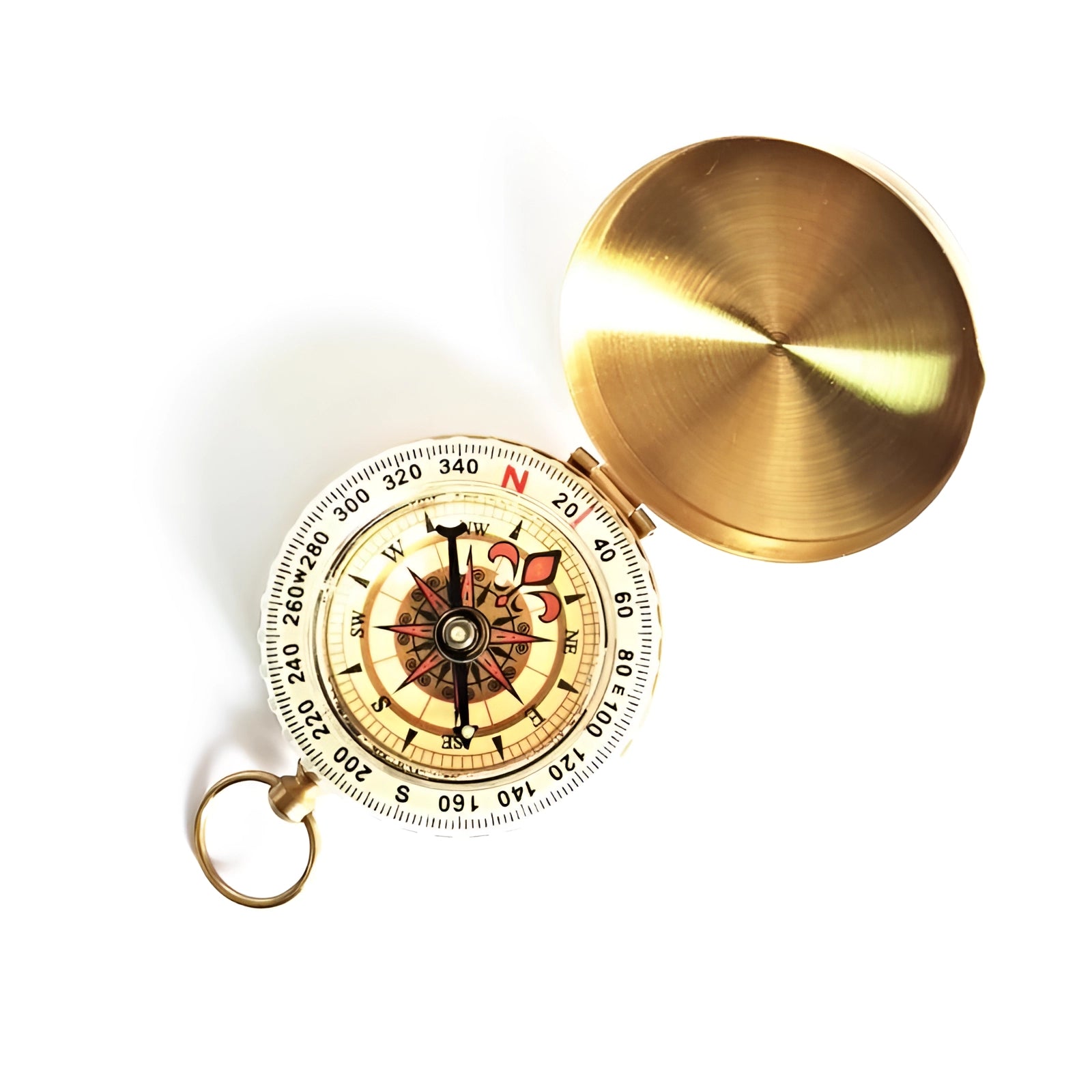 Antique brass pocket compass with a glow-in-the-dark dial, surrounded by wooden background elements.