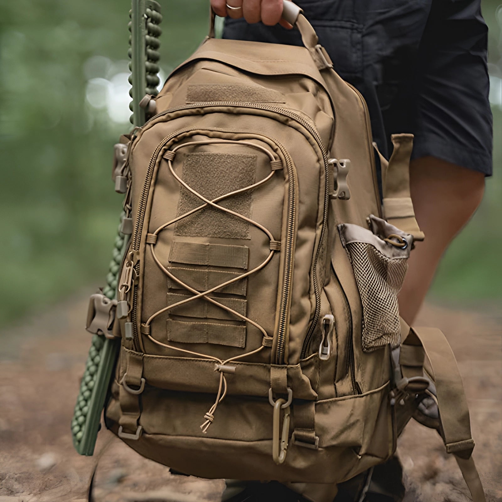 Camouflage military-grade tactical backpack with water-resistant material, MOLLE webbing, and hydration-ready feature.