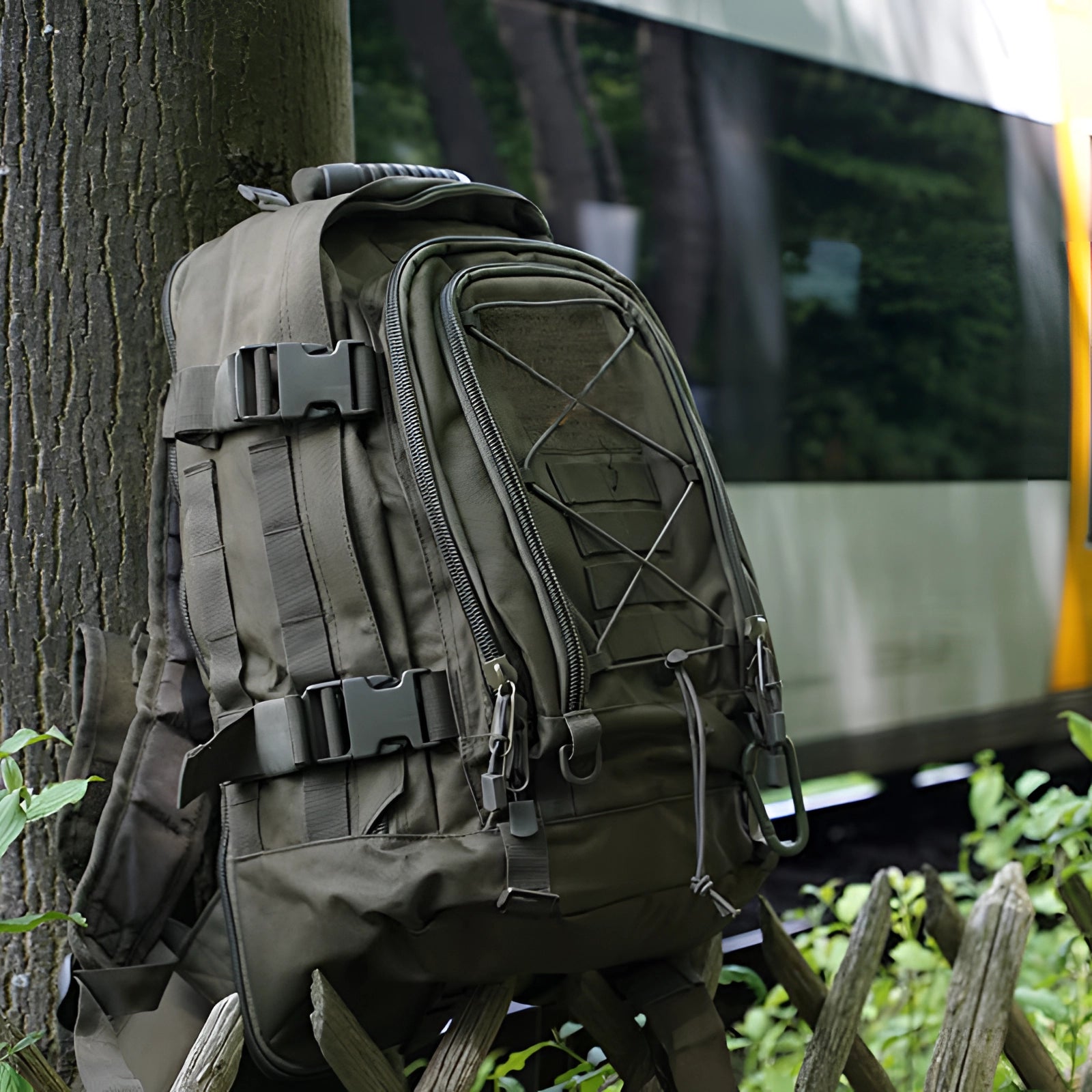 Camouflage military-grade tactical backpack, water-resistant with MOLLE system and hydration-ready, displayed on a vehicle.