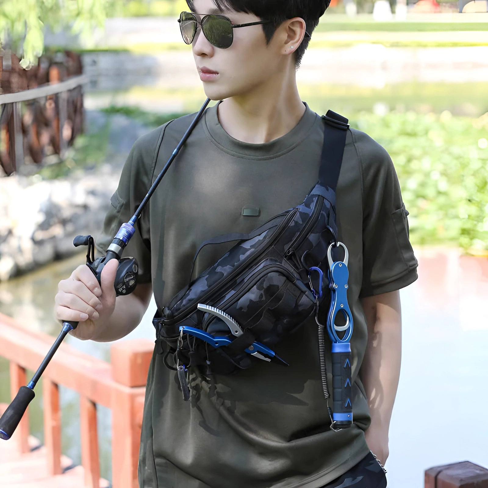 Camouflage tactical waist bag with durable and secure multi-compartment design, displayed outdoors with greenery in the background.