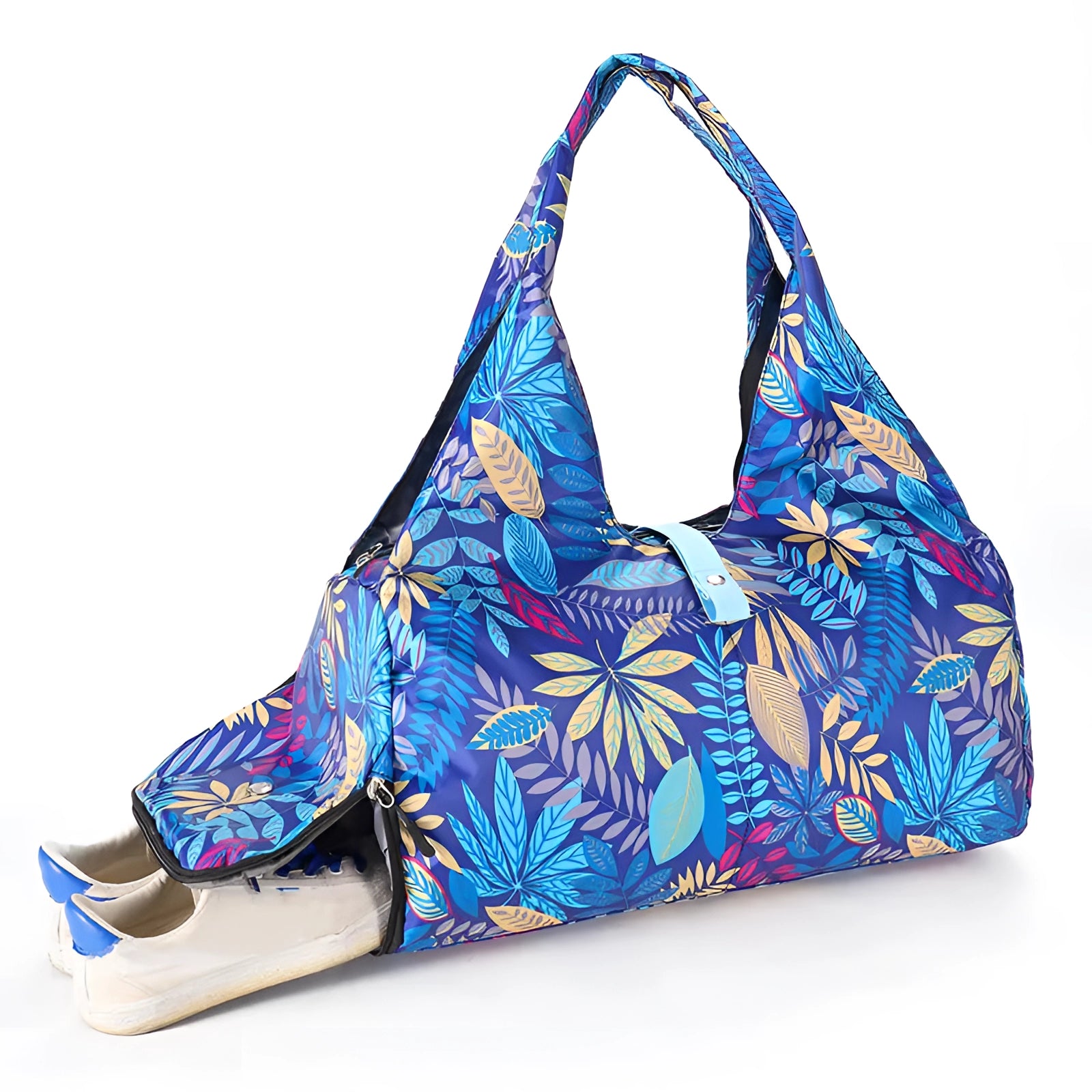 Convertible yoga mat bag with shoe compartment, featuring a large capacity design in electric blue with a fashionable pattern. The bag includes a shoulder strap for easy carrying and has a sleek, triangular shape.