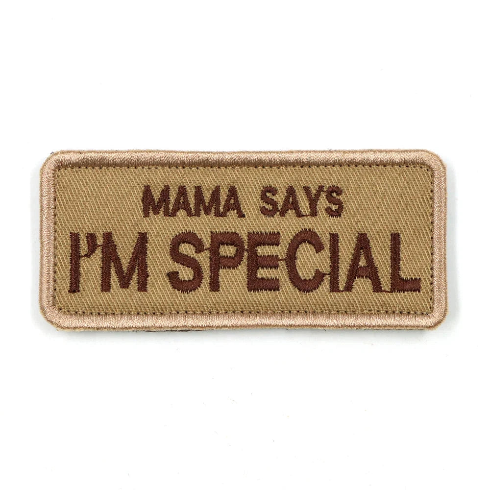 Customizable rectangular harness patch with "MAMA Says I'M Special" text, suitable for service dogs, made of durable material and designed as a fashion accessory for pet harnesses.