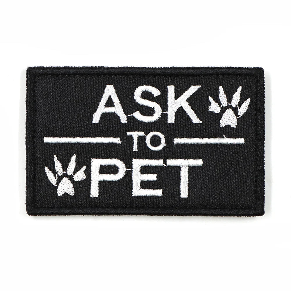 Black rectangular harness patch with white text "Ask To Pet" in bold font, designed for K9 service dogs.