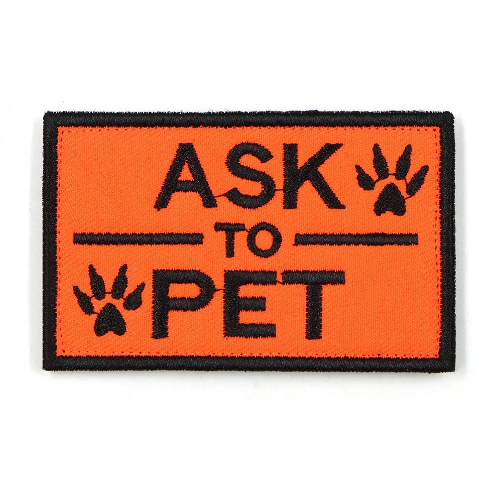 Orange rectangular harness patch with bold black font reading "Ask To Pet" designed for service dogs.