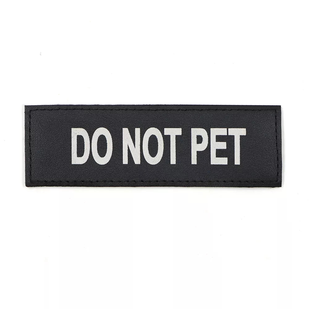 Blue rectangular harness patch with "Do Not Pet" text in white font.