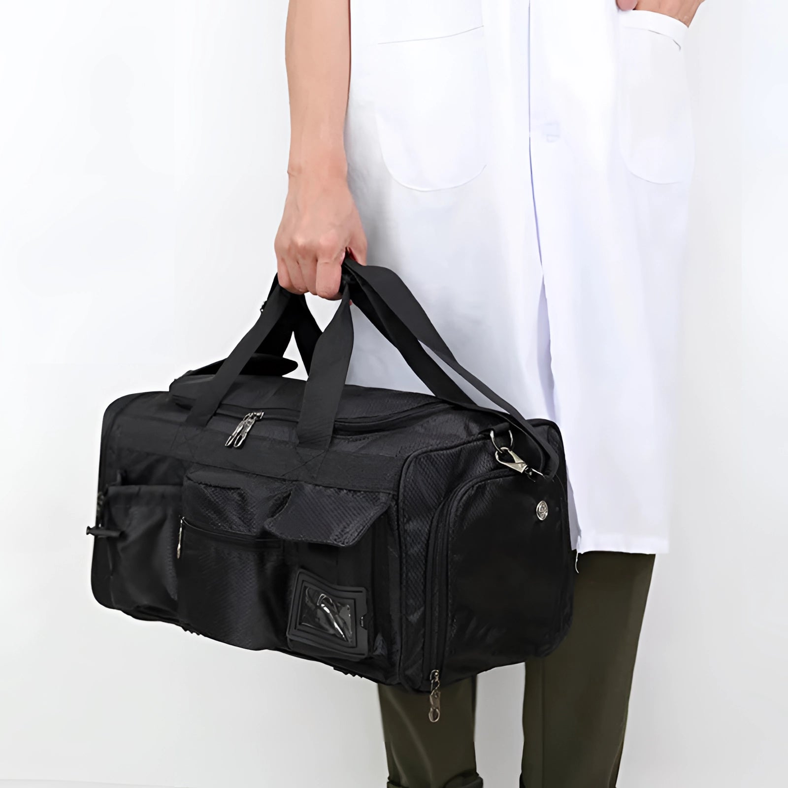 Black expandable waterproof gym duffel bag with a shoe compartment, featuring a shoulder strap for easy carrying.