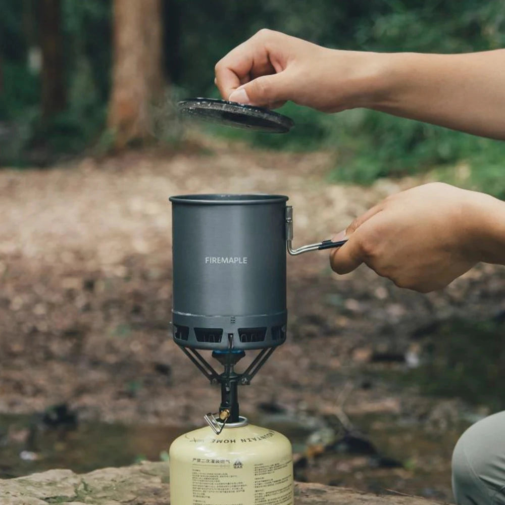 Ultralight camping pot with heat exchanger, designed for efficient cooking outdoors.