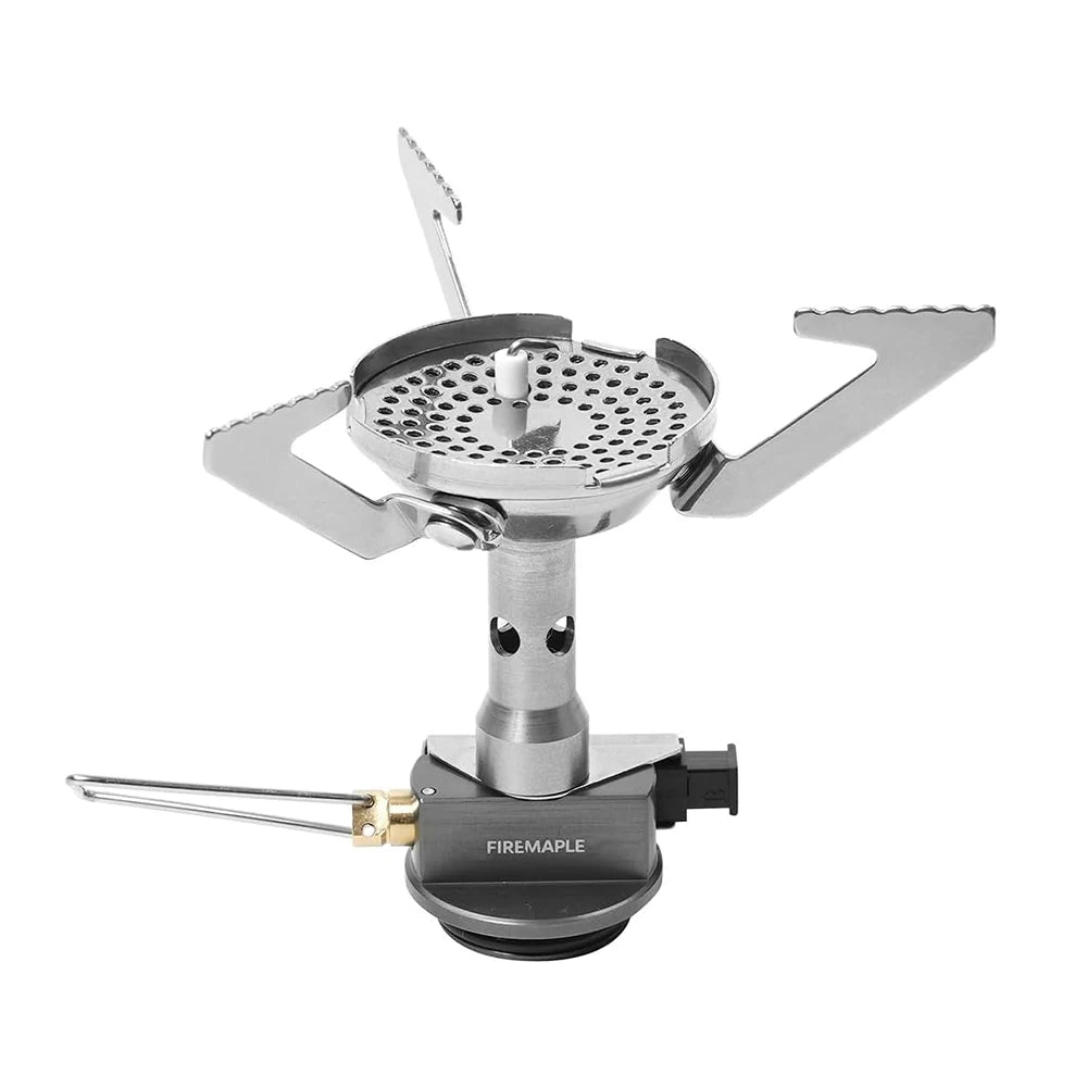 Portable FireMaple GreenPeak camping stove with a windproof design, made of lightweight and compact metal, suitable for outdoor cooking.