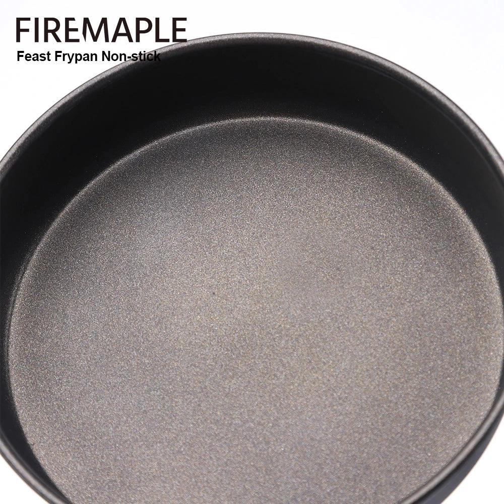 
A non-stick camping frypan with a foldable handle, designed for easy packing and lightweight portability. The frypan has a smooth, durable surface suitable for outdoor cooking.