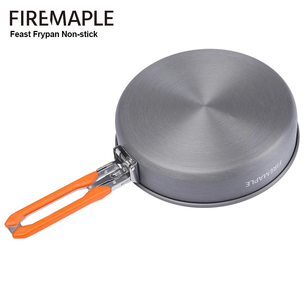 A non-stick camping frypan by FireMaple, featuring a lightweight design and a foldable handle for easy portability and storage, suitable for outdoor cooking.