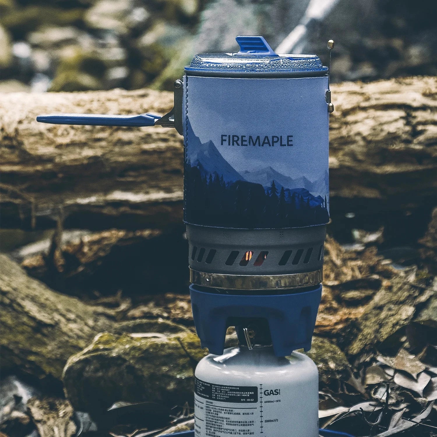 Portable FireMaple Polaris X5 backpacking stove set up outdoors, designed for fuel efficiency, with a focus on lightweight and compact design suitable for camping and backpacking trips.