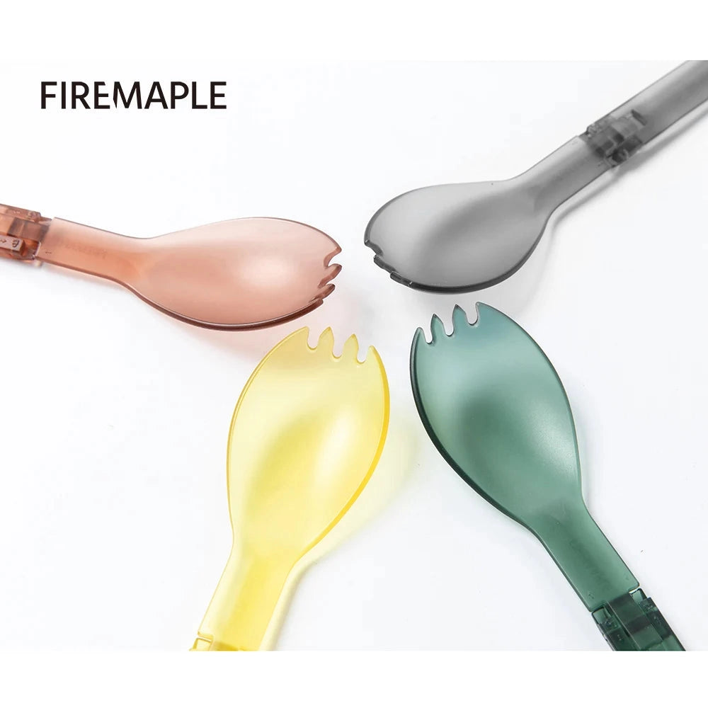 FireMaple Tritan Spork - a lightweight, durable, BPA-free camping tool held in a hand, showcasing its ergonomic design and multi-functional use as cutlery.