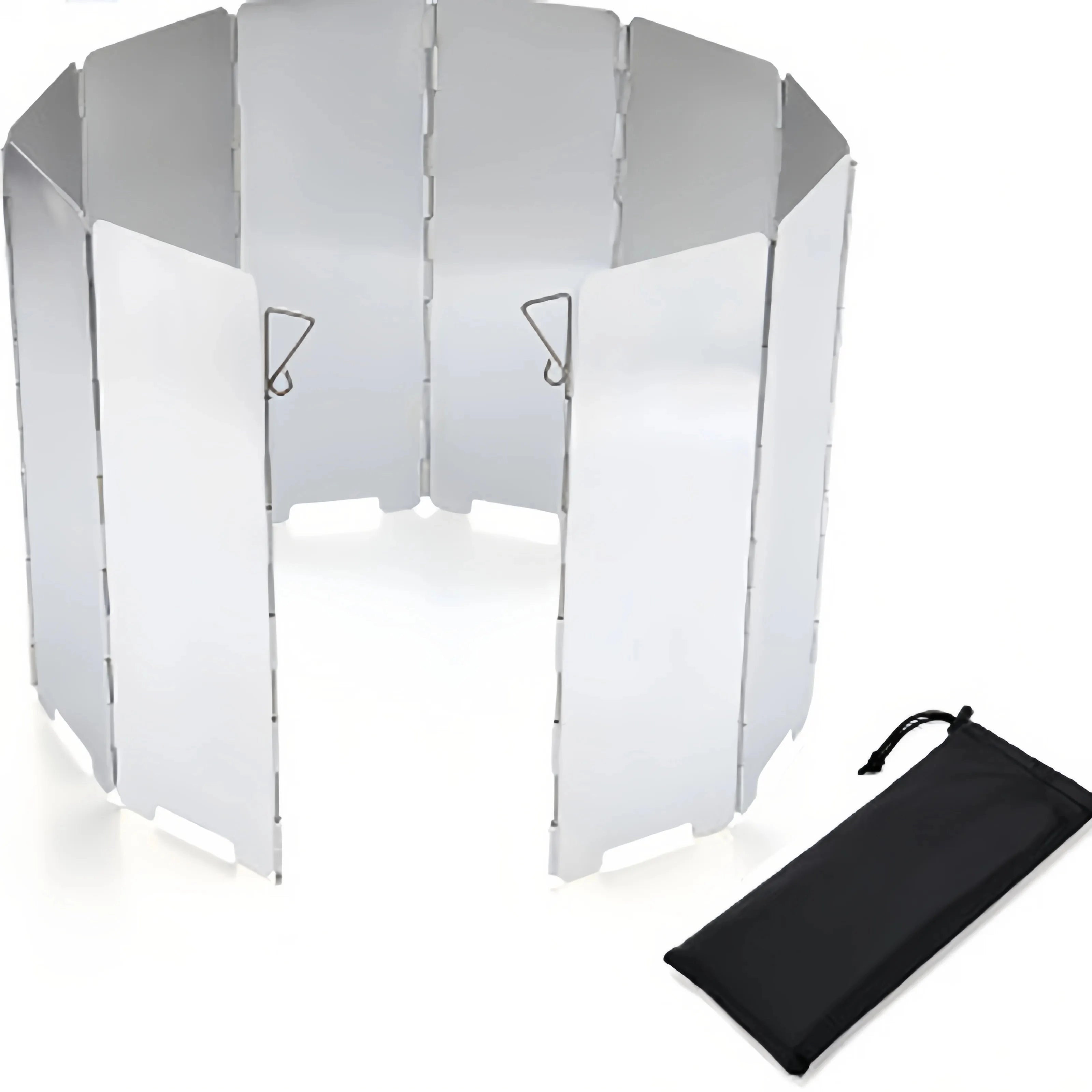 Foldable aluminum camping stove windscreen set up outdoors, highlighting its lightweight design and effectiveness as a wind guard.