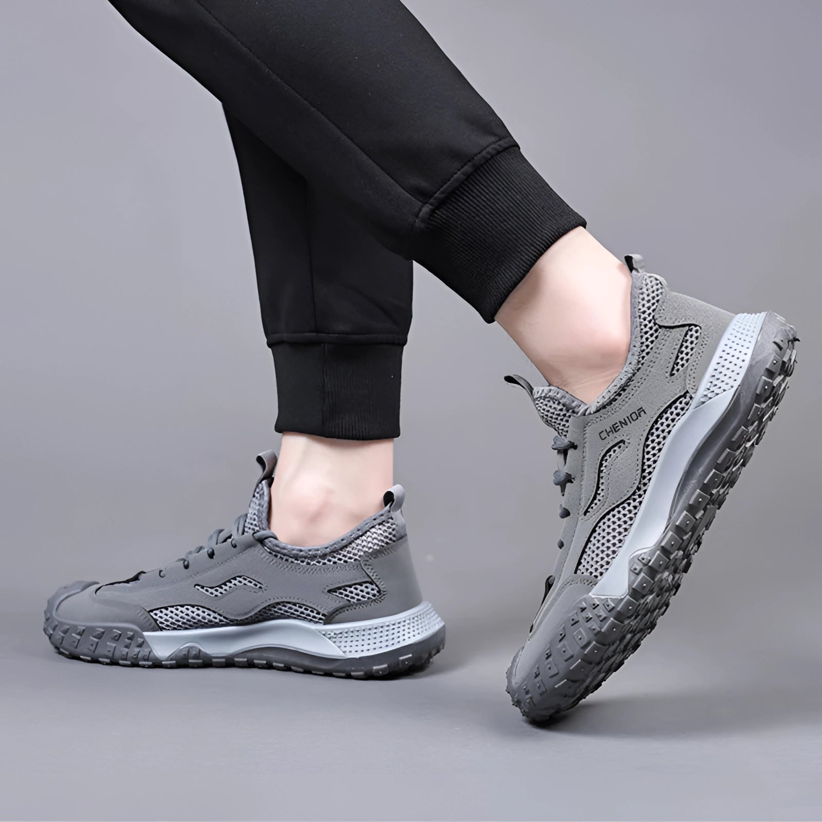 Lightweight grey men's hiking shoes designed for breathability and all-terrain use, showcasing a fashion-forward design suitable for sportswear.