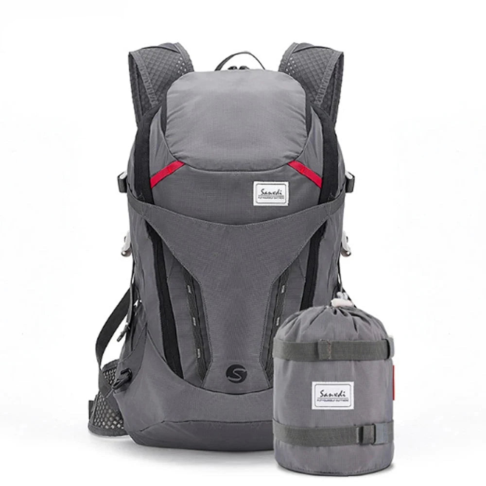 Lightweight water-resistant Scione backpack in grey with electric blue accents, designed for travel and adventure, featuring durable composite material and functional compartments.