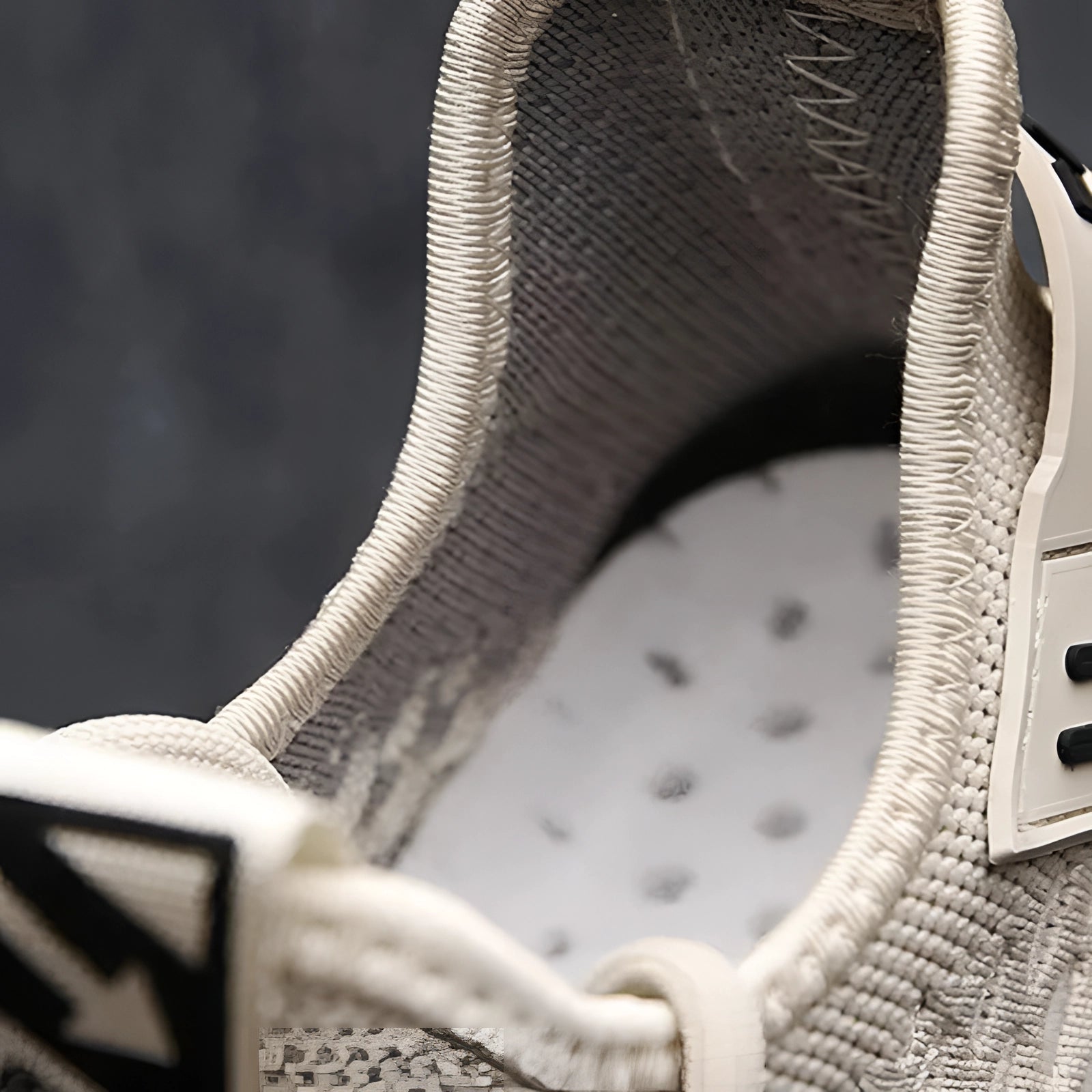 Beige knit sneakers with a lightweight and breathable design shown in monochrome.