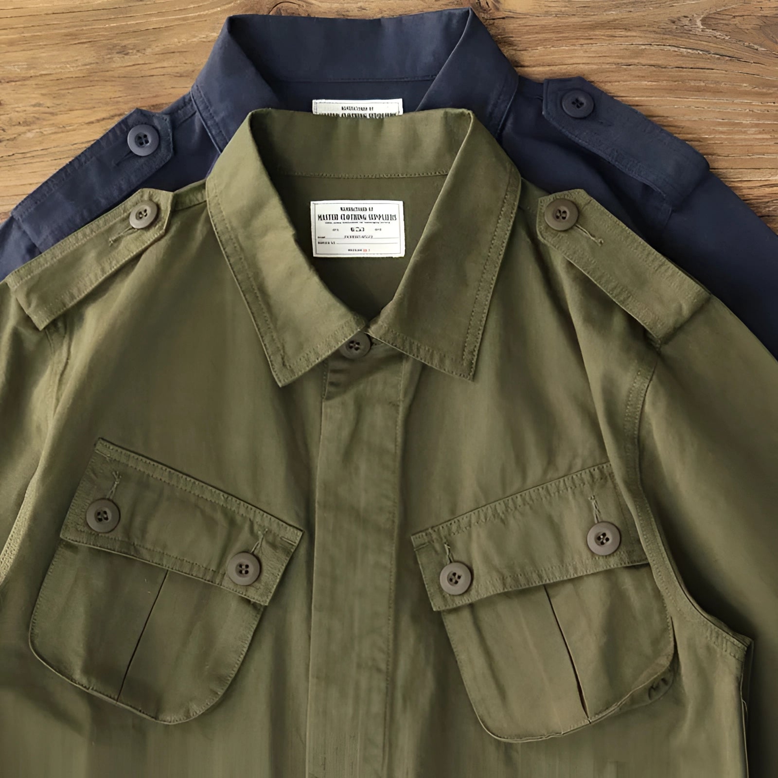 Men's green tactical military utility jacket featuring a structured collar, buttoned front, and long sleeves, designed for outdoor use.