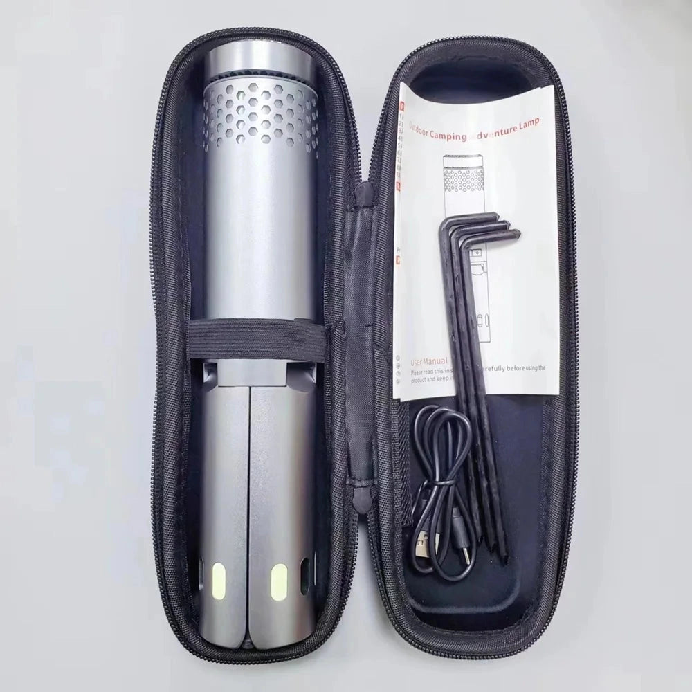 Grey Portable Rechargeable Telescopic LED Camping Lantern, Waterproof, 10000mAh, placed on an outdoor surface displaying its compact and durable design.