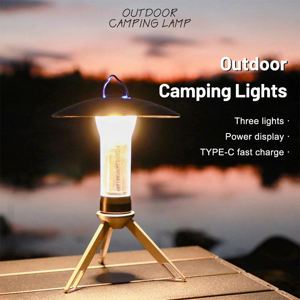 Rechargeable LED Camping Lantern placed outdoors on wooden surface, bright sunlight in the background, natural landscape, and a chair nearby.