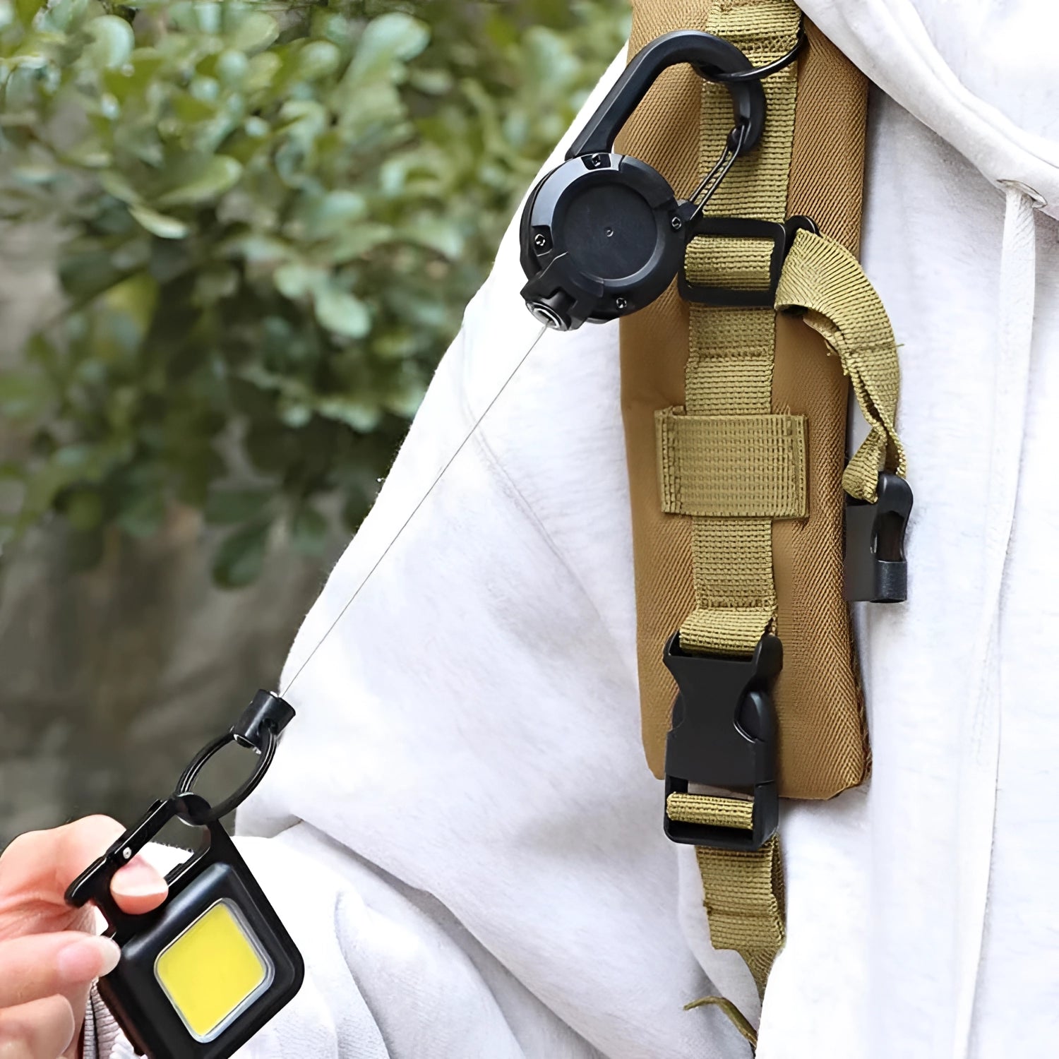 Durable quick release D-rings for military gear attached to tactical backpack showing webbing and material properties.