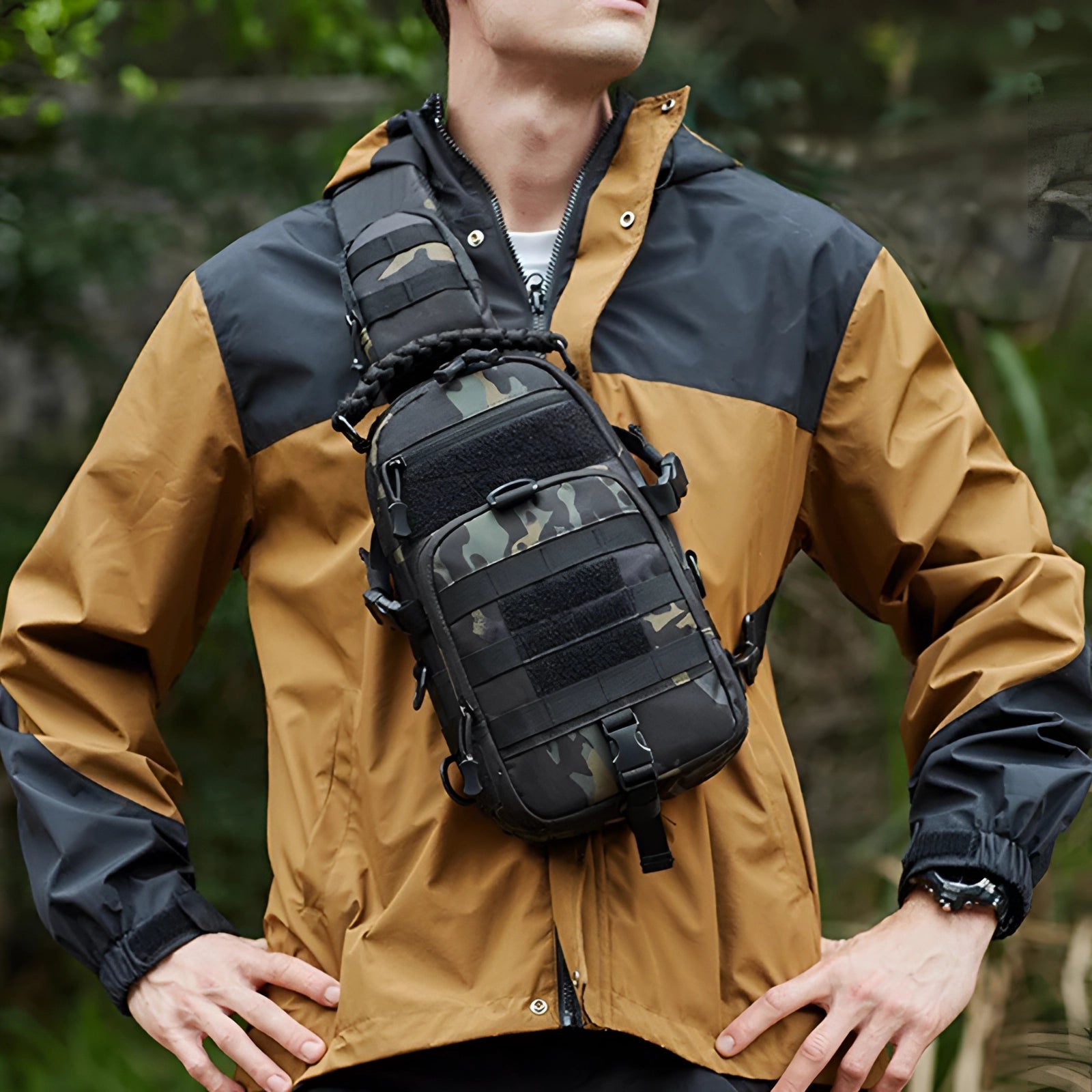 Tactical chest bag with modular pouches in a camouflage pattern, designed for outdoor use, displayed against a natural background.