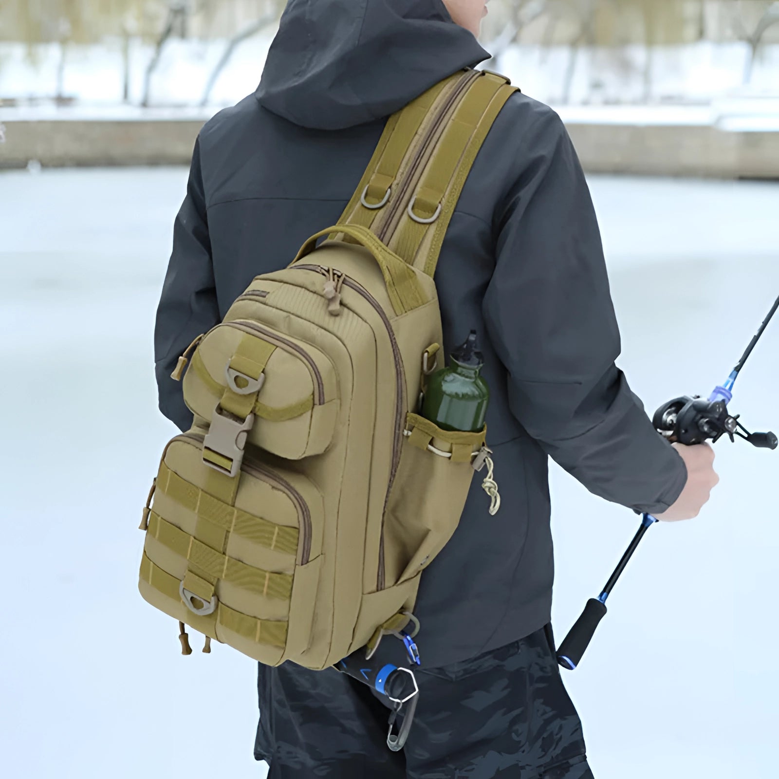 Tactical Fishing Backpack - Waterproof Sling Bag featuring a rod holder, being worn by a person dressed in winter outerwear and safety gloves, with a focus on the backpack's sturdy and functional design suitable for fishing in cold weather conditions.