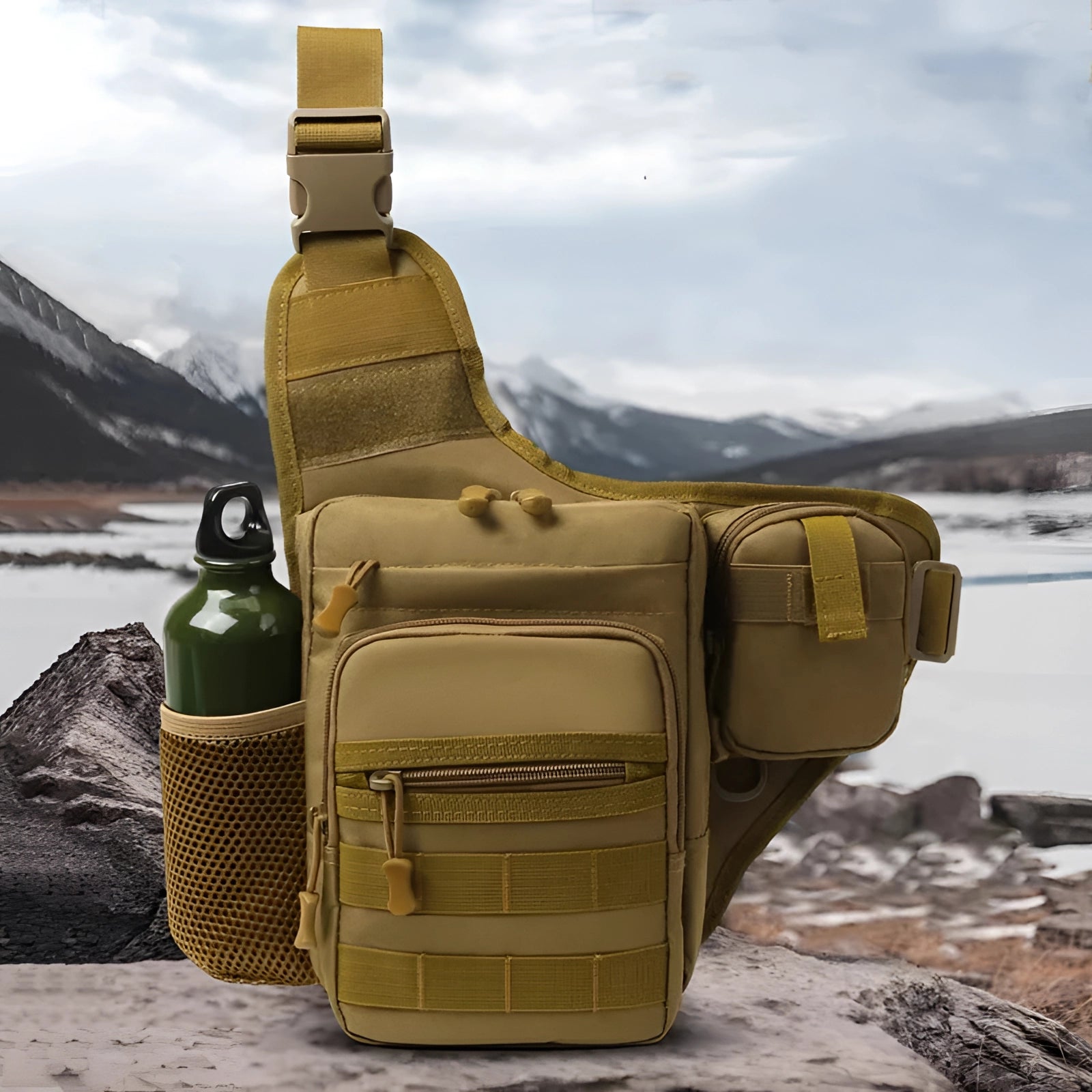 Tactical sling bag with a military Molle design, displayed outdoors against a cloudy sky and mountainous landscape, showcasing its water-resistant features ideal for travel.