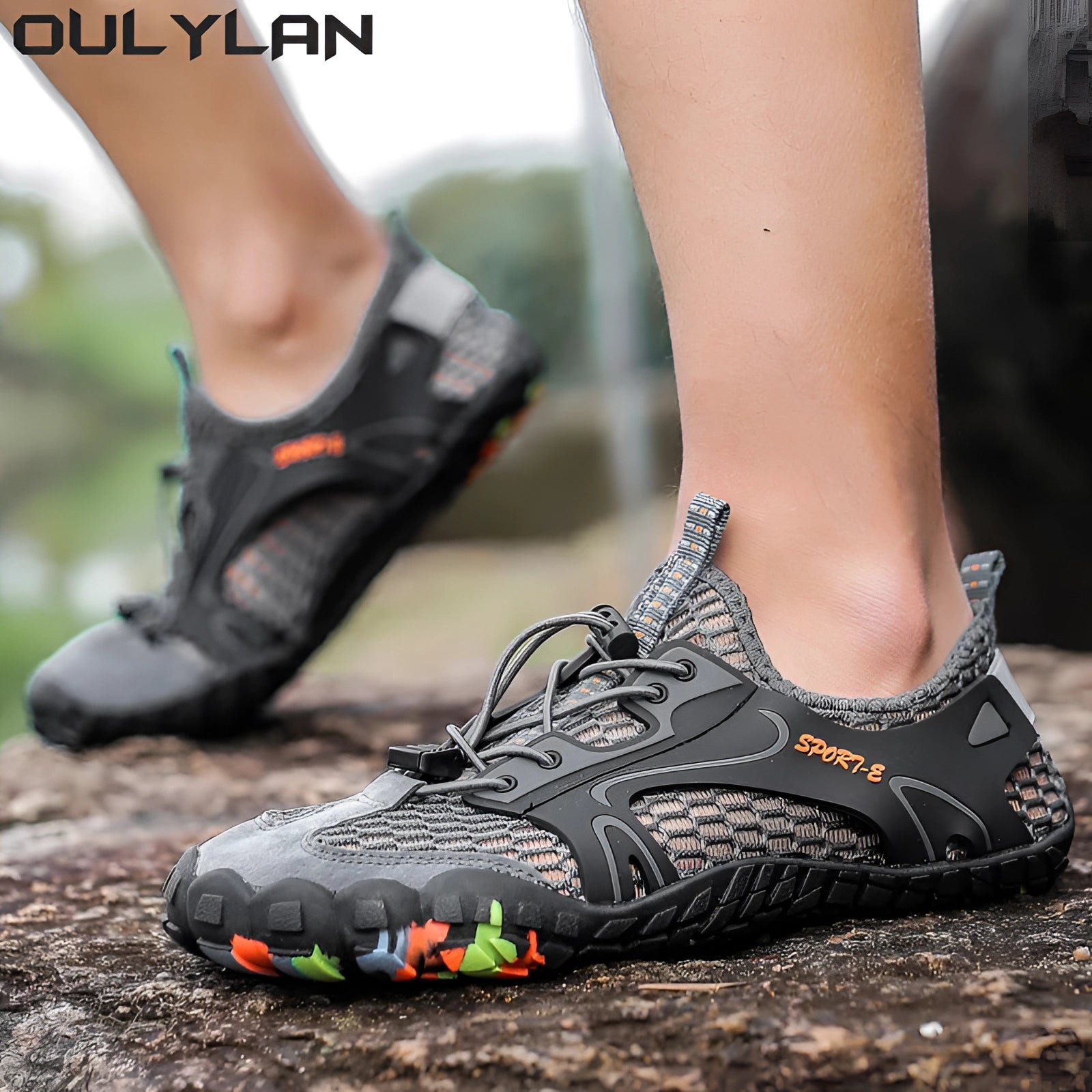 Black water-resistant hiking sneakers designed for trail use, featuring a quick-dry and non-slip sole, shown on a grassy surface.