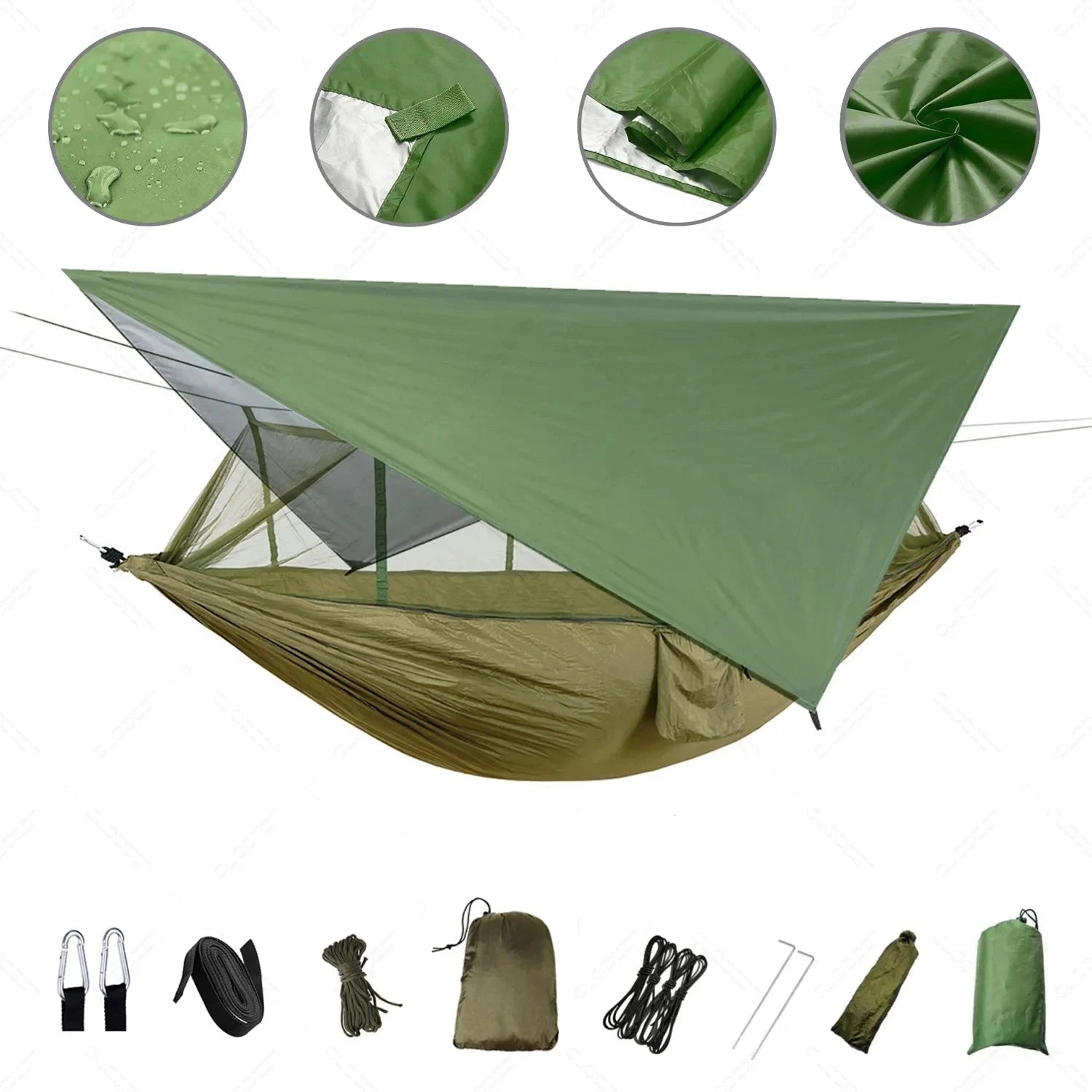 Green waterproof camping hammock with mosquito net and rain fly setup outdoors, surrounded by grass and plants.