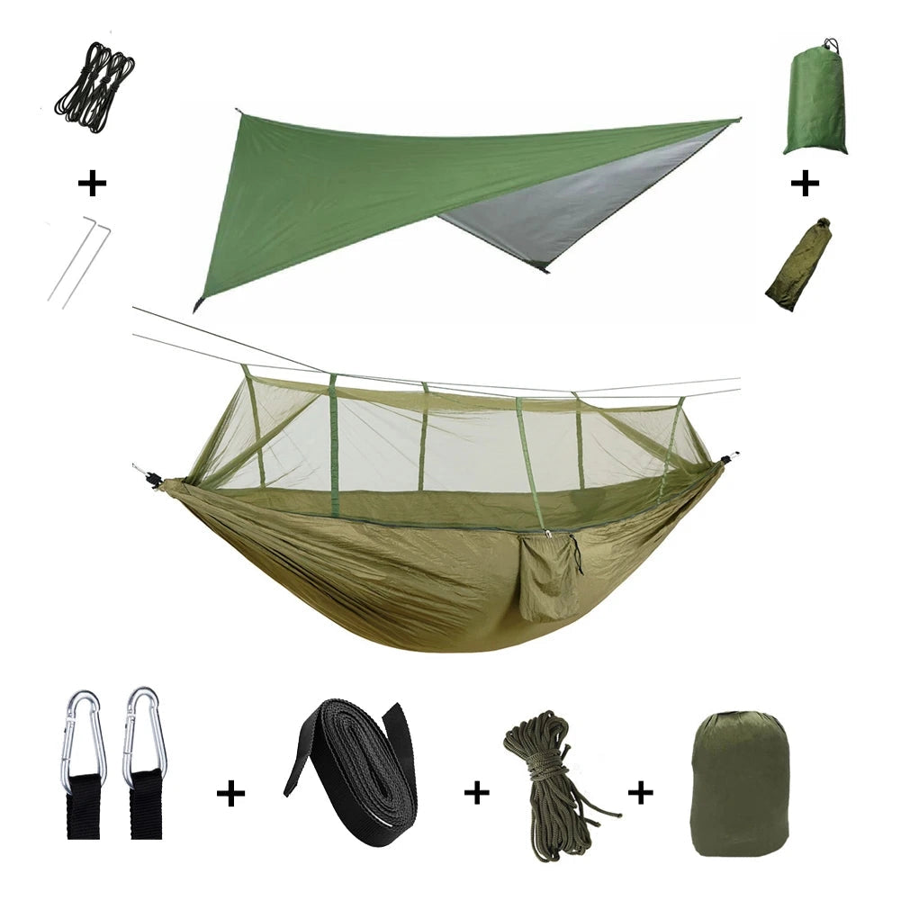 Army green waterproof camping hammock with integrated mosquito net and rain fly, lightweight, and portable.