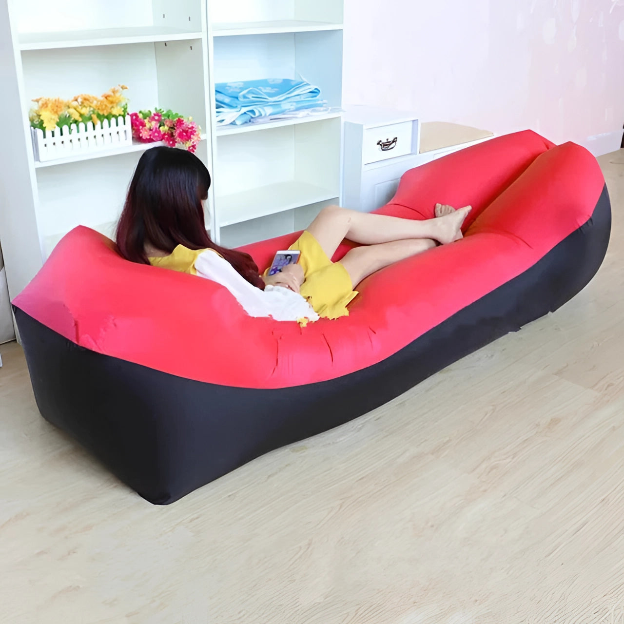 Red Waterproof Outdoor Inflatable Sofa - Portable Quick-Inflate Air Couch suitable for recreation and leisure, shown on a flooring setup, resembling a bean bag chair.