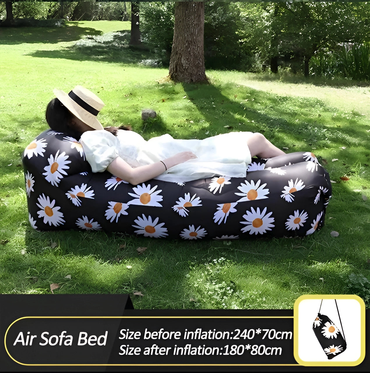 Waterproof outdoor inflatable sofa set up on grass with trees in the background, portable and quick to inflate, resembling a comfortable air couch.