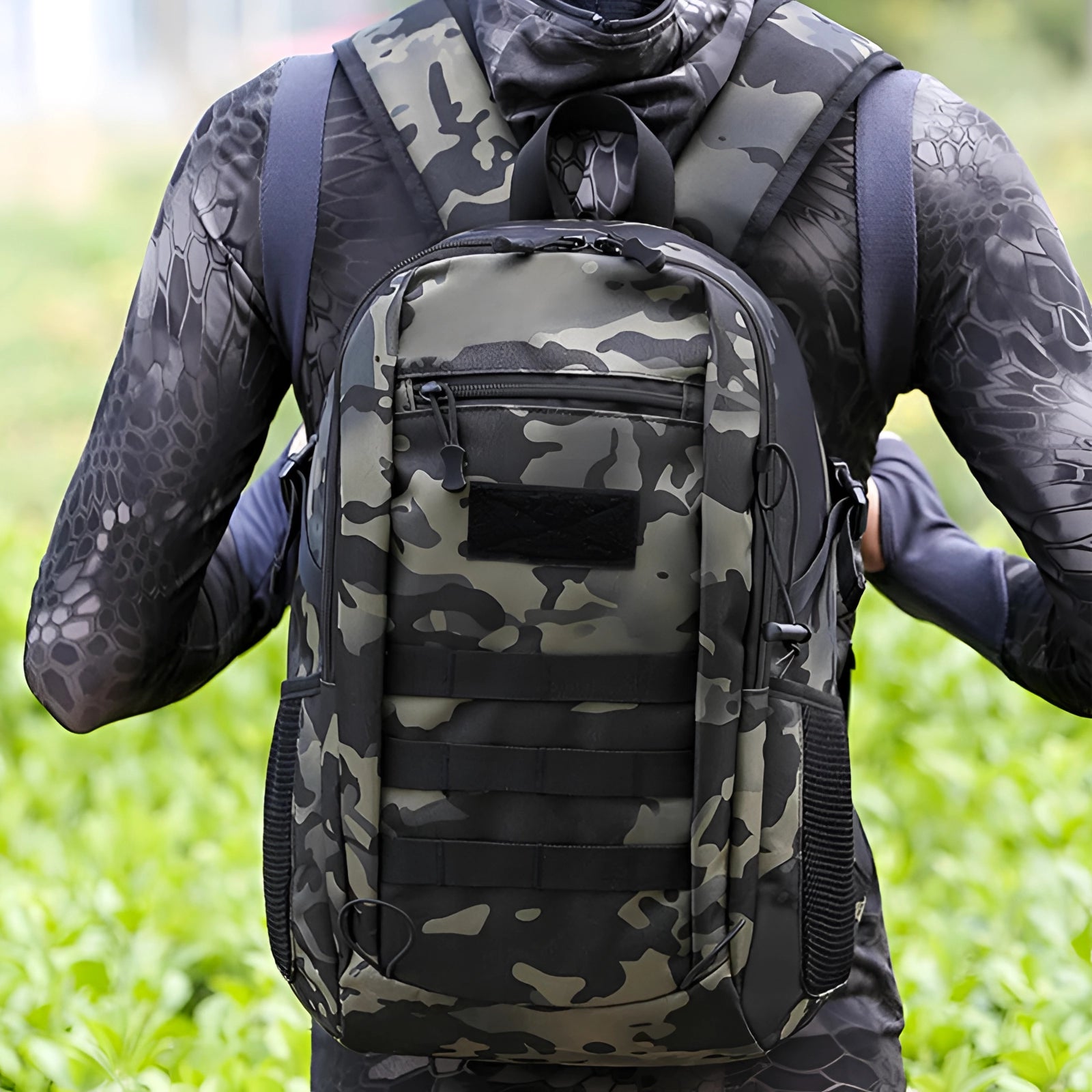 Waterproof tactical backpack featuring a durable MOLLE system, displayed in a camouflage pattern with black and green accents, suitable for military or outdoor use.