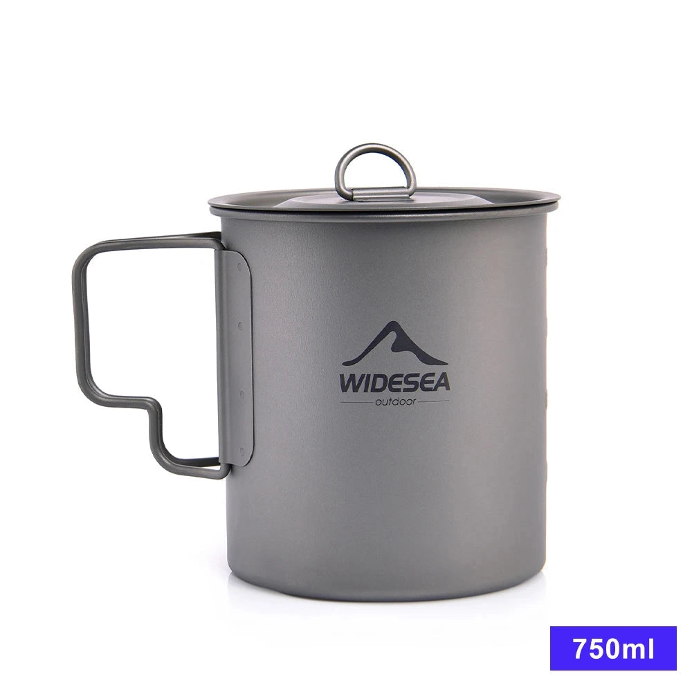 Titanium camping mug with a 750ml capacity, featuring a lightweight and portable design. The mug is part of a cookware set and is suitable for holding liquids.