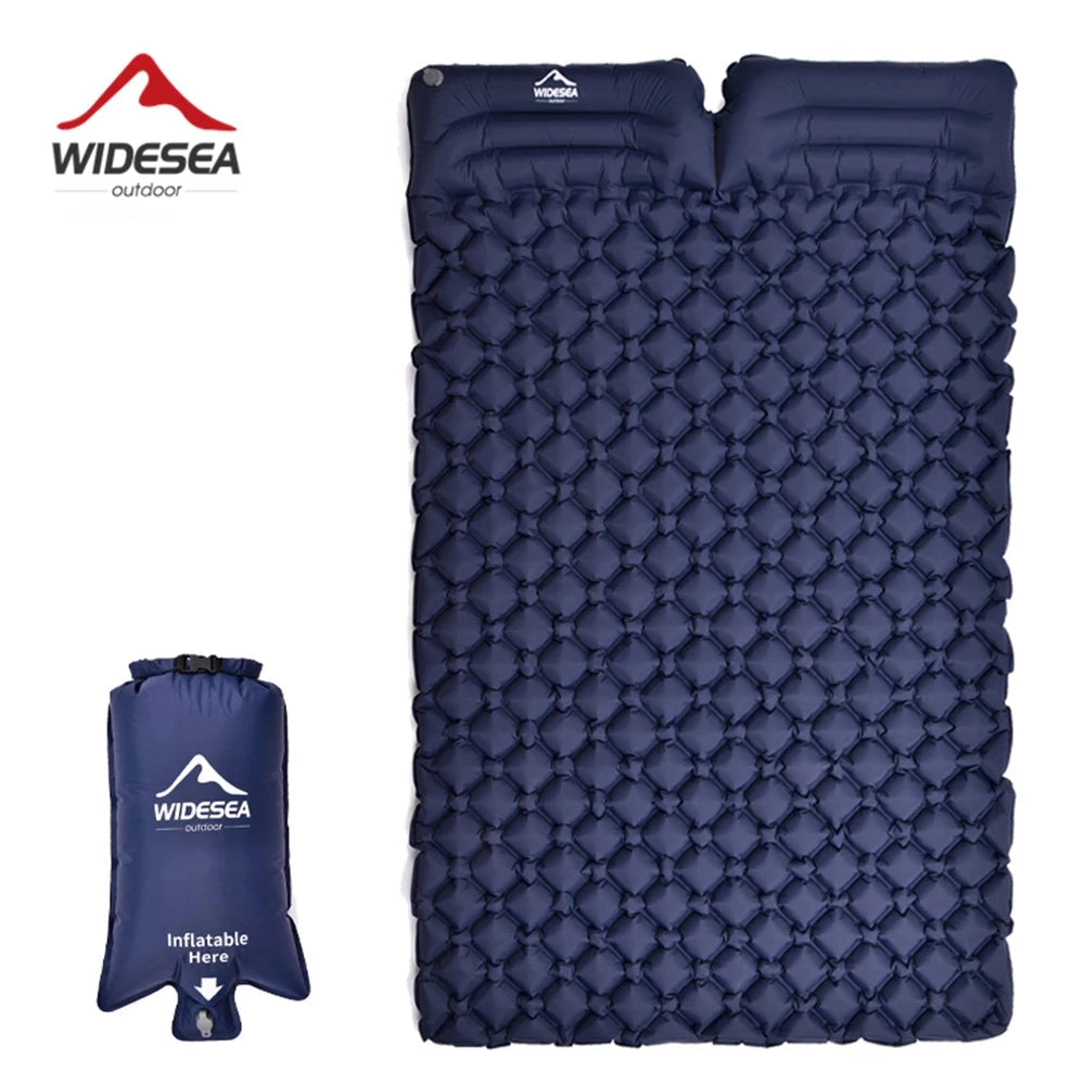 Ultralight double-wide inflatable camping mattress in electric blue, shown rolled up and secured with a strap, resembling a compact and portable bag.