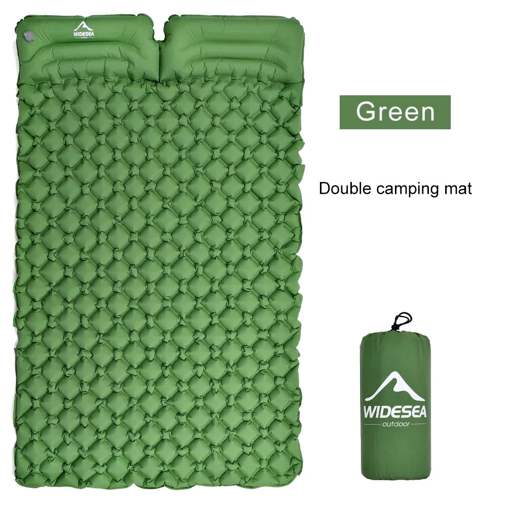 Ultralight double-wide green inflatable camping mattress with a rectangular shape and patterned surface.