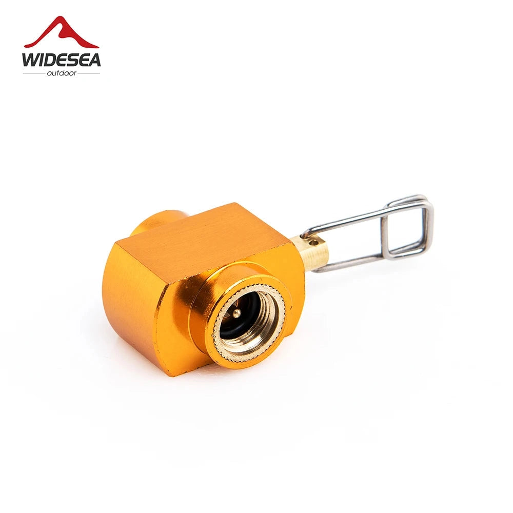 Portable camping stove adapter with a cylindrical design, used for converting gas canisters. It features a metallic connector and wire components, suitable for outdoor cooking and compatible with various gas types.