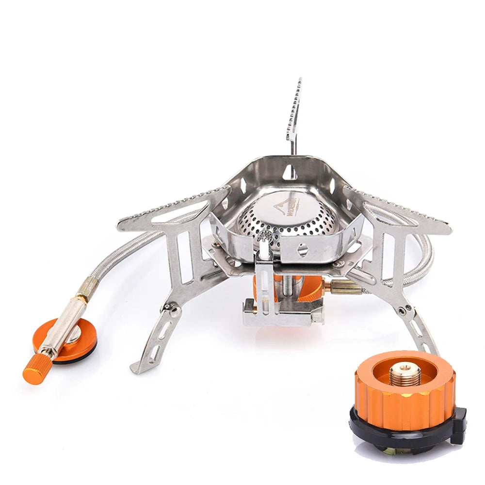 Portable windproof camping stove made of stainless steel, featuring a compact design suitable for outdoor use; includes an adaptor for easy connection to gas canisters.